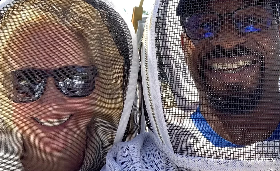 Dave and Christy Wilson in their beekeeping suits